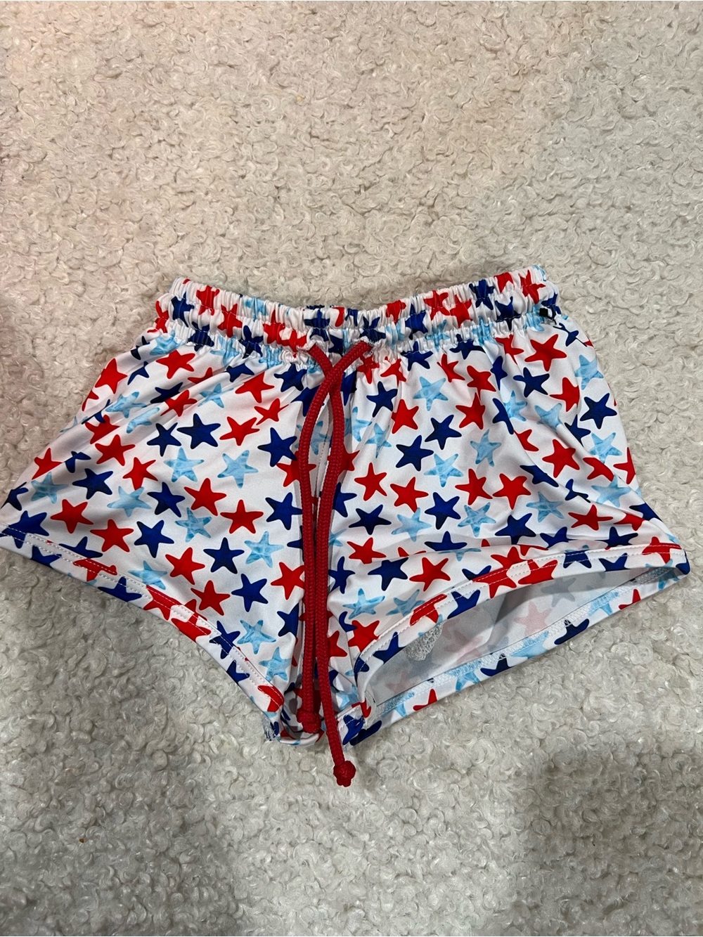 James & Lottie Baby White Star-Print Swim Shorts with Red & Blue Accent